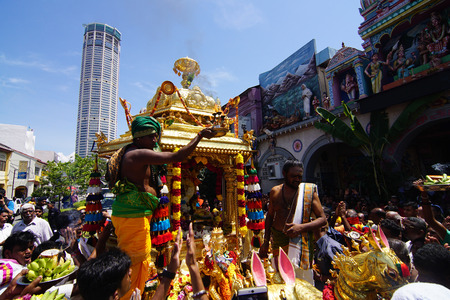 GEORGETOWN, PENANG/MALAYSIA ?? CIRCA FEB 2017: Priest of gold chariot carrying traditional oil lamp in front of Sri Kamatchi Amman Temple during Thaipusam celebration.のeditorial素材