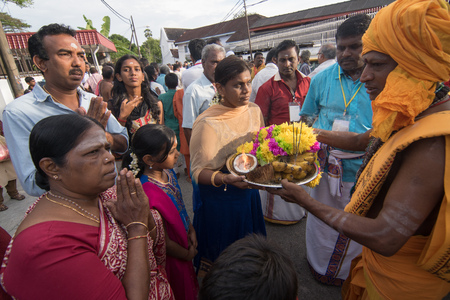 GEORGETOWN, PENANG/MALAYSIA ?? CIRCA FEB 2017: Priest carry offering flower from devotee during Thaipusam.のeditorial素材