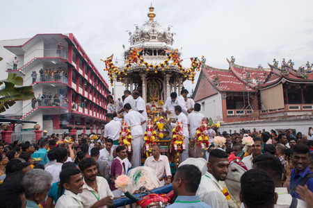 GEORGETOWN, PENANG/MALAYSIA ?? CIRCA FEB 2017: Silver chariot with the devotees with background chinese temple and Beach Street Bomba station during Thaipusam.のeditorial素材
