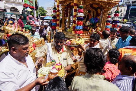 GEORGETOWN, PENANG/MALAYSIA ?? CIRCA FEB 2017: Thaipusam celebration with offering of flower and fruit by devotees in front gold chariot during Thaipusam festival.のeditorial素材