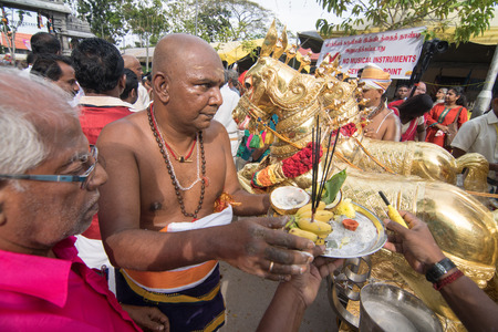 GEORGETOWN, PENANG/MALAYSIA ?? CIRCA FEB 2017: Priest receive offering from devotees during Thaipusam.のeditorial素材