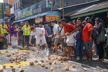 GEORGETOWN, PENANG/MALAYSIA ?? CIRCA FEB 2017: Coconuts are smashed onto the ground to fulfill sacred vows during Thaipusam festival.のeditorial素材