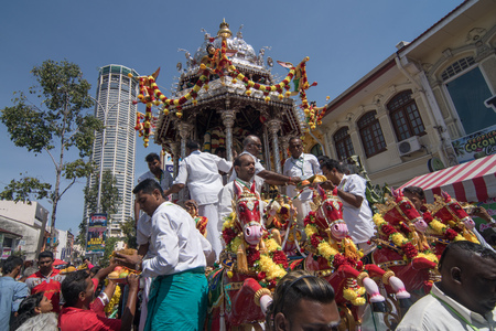 GEORGETOWN, PENANG/MALAYSIA ?? CIRCA FEB 2017:Silver chariot with devotees offering in front of shop house and Komtar.のeditorial素材