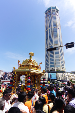 GEORGETOWN, PENANG/MALAYSIA ?? CIRCA FEB 2017: Gold chariot pass the tallest building of Penang during procession of Thaipusam.のeditorial素材