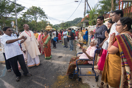 GEORGETOWN, PENANG/MALAYSIA ?? CIRCA FEB 2017: Family take photos during gold chariot procession at housing area.のeditorial素材