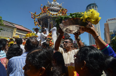 Georgetown,Penang.Malaysia â CIRCA JAN 2016: Devotees make their offering for lord Murugan in silver chariot.のeditorial素材