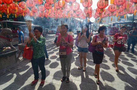 GEORGETOWN, PENANG/MALAYSIA - 13 FEB 2016: Chinese Burning Incense or worship at temple Goddess of Mercy.のeditorial素材