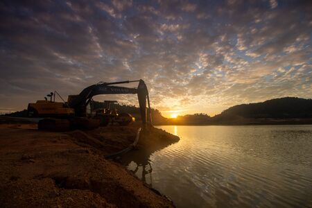 Bukit Mertajam, Penang/Malaysia - Jan 29 2016: Excavator is used at the expansion of the Mengkuang...