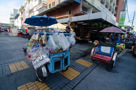 George Town, Penang/Malaysia - Jun 25 2016: Passenger trishaw and bread trishaw park at the street beside Chowrasta wet market.のeditorial素材