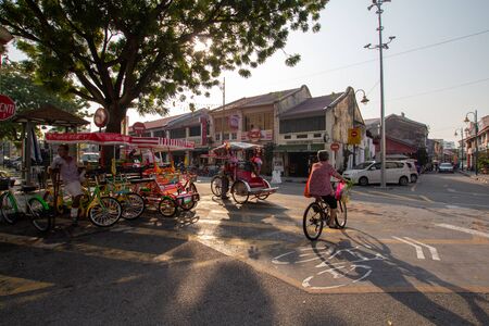 George Town, Penang/Malaysia - Jul 02 2016: An elder woman go home after buy vegetables at the wet market.のeditorial素材