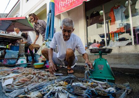 George Town, Penang/Malaysia - Jul 30 2016: Fisherman hawkers sell the dish at the stall at morning wet market at Jalan Kuala Kangsar.のeditorial素材