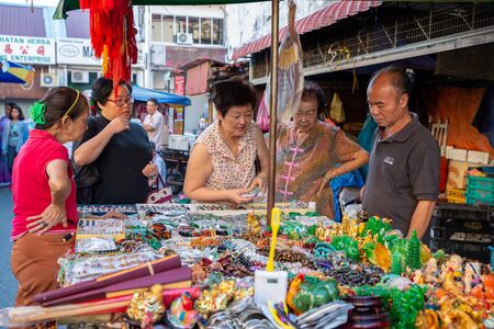 George Town, Penang/Malaysia - Jul 30 2016: Women buy the jewelry in market.のeditorial素材