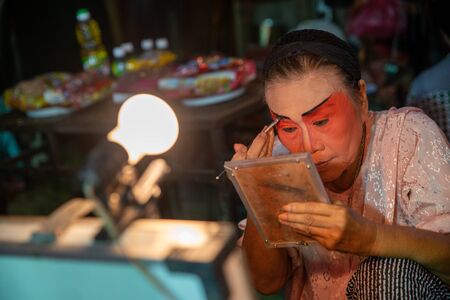 Bukit Mertajam, Penang/Malaysia - Aug 17 2016: An actress make up during opera performance.のeditorial素材