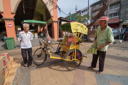 Kelantan/Malaysia - Jul 15 2017: A man use rickshaw to carry goods.のeditorial素材