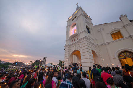 Bukit Mertajam, Penang/Malaysia - Jul 29 2017: Devotees attend with white candle during last day of St Anne feast.のeditorial素材