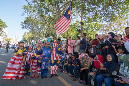 George Town, Penang/Malaysia - Aug 31 2017: Malaysian with jalur gemilang costume stand together.のeditorial素材