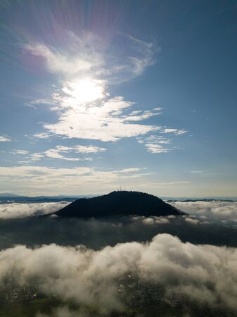 Aerial vertical BM hill covered by sea cloud.の写真素材