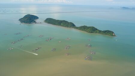 Aerial view boat move near fish farm at sea near Pulau Aman and Pulau Gedong at Pulau Pinang.の写真素材