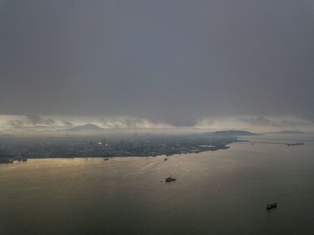 Aerial view Seberang Perai from sea in raining day.の写真素材
