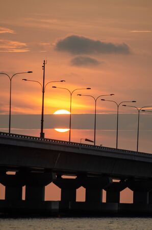 Half of sun disappear in cloud at Penang second bridge.の写真素材
