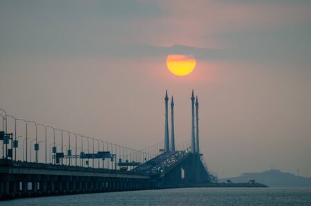 Egg yolk sunrise in hazy cloud in morning.の写真素材