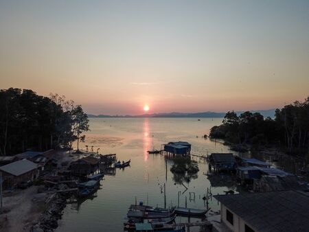 Fishing village in sunset.
