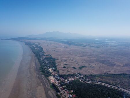 Aerial view dry season at paddy field after harvested at Kedah.