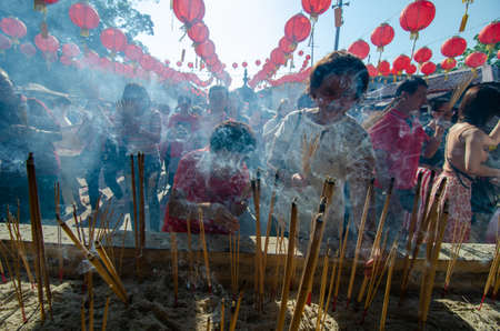 Georgetown, Penang/Malaysia - Jan 25 2020: People pray with incense stick at Goddess of Mercy temple.のeditorial素材