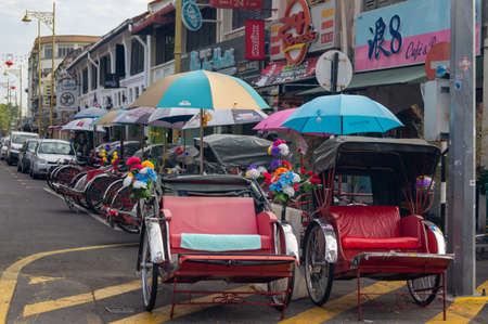 Georgetown, Penang/Malaysia - Feb 14 2020: Row of rickshaw park at street.