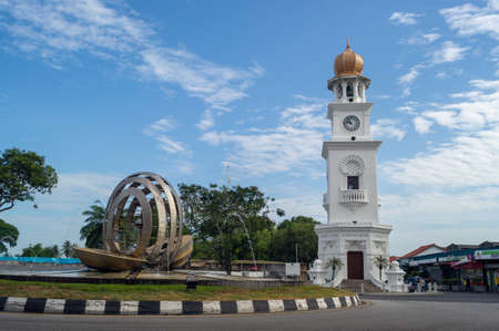 Georgetown, Penang/Malaysia - Feb 14 2020: Queen Victoria Memorial clock tower with fountain under blue sunny day.のeditorial素材