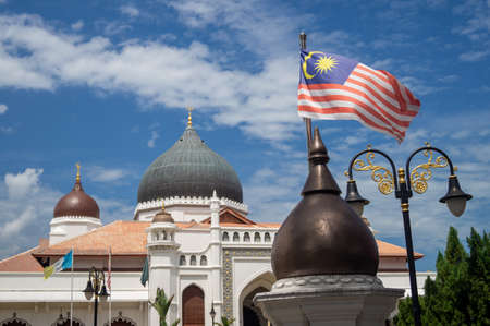 Georgetown, Penang/Malaysia - Feb 14 2020: Malaysia flag and architecture Masjid Kapitan Keling Mosque.のeditorial素材