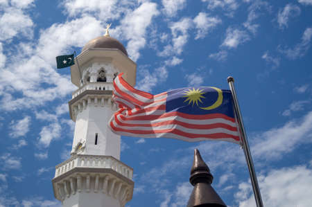 Georgetown, Penang/Malaysia - Feb 14 2020: Malaysia flag wave at Kapitan Keling Mosqueのeditorial素材