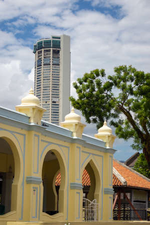 Georgetown, Penang/Malaysia - Feb 14 2020: Beautiful Malays mosque Acheh Mosque at Lebuh Acheh. Background is KOMTAR building.のeditorial素材