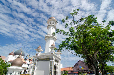 GeorgetownPenang/Malaysia - Feb 14 2020: Minaret at mosque under blue sky.