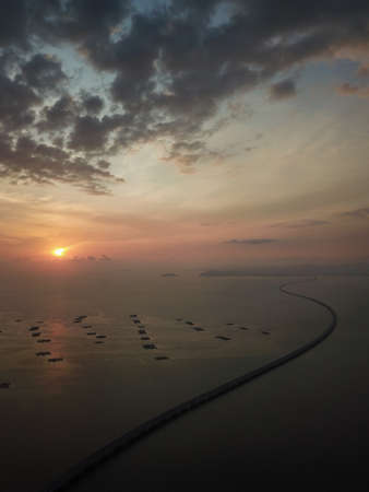 Batu Kawan, Penang/Malaysia - Feb 27 2020: Aerial curve Sultan Abdul Halim Muadzam Shah Bridge in golden sunset.のeditorial素材