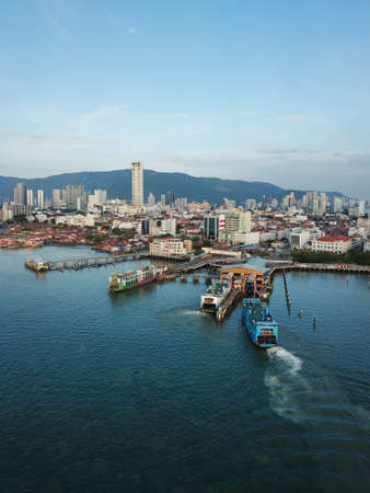 Georgetown, Penang/Malaysia - Feb 28 2020: Aerial blue ferry arrive Penang Terminal.のeditorial素材