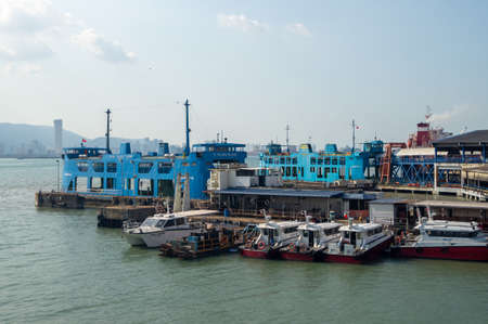 Georgetown, Penang/Malaysia - Feb 29 2020: Blue ferry park at terminal Butterworth.