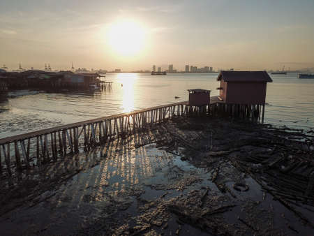 Georgetown, Penang/Malaysia - Feb 29 2020: Georgetown heritage old wooden bridge at Tan Jetty in morning with shadow,のeditorial素材