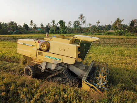 Georgetown, Penang/Malaysia - Feb 29 2020: Harvester machine is used by farmer to harvest rice paddy...