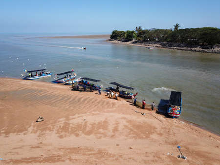 Penaga, Penang/Malaysia - Mar 14 2020: A boat sail back to jetty. Fisherman clear the net.のeditorial素材