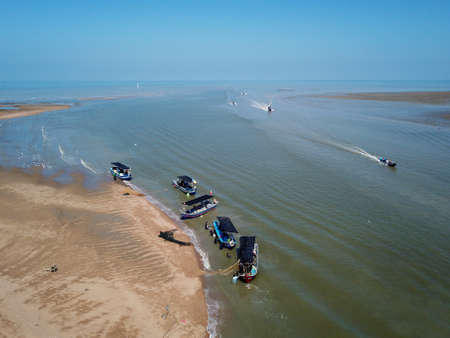 Penaga, Penang/Malaysia - Mar 14 2020: Fishing boats sail back to jetty.のeditorial素材