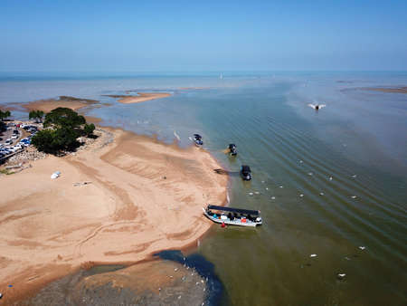 Penaga, Penang/Malaysia - Mar 14 2020: Egret fly near fisherman boat search for food.のeditorial素材