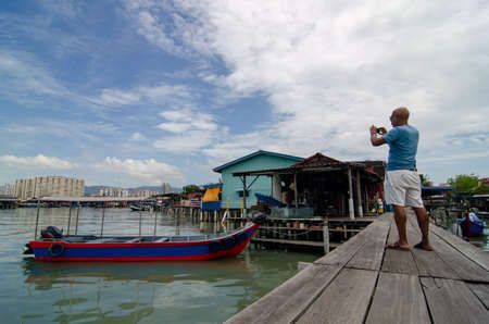 Georgetown, Penang/Malaysia - Jun 02 2018: A tourist capture photo at Clan Jetty.のeditorial素材