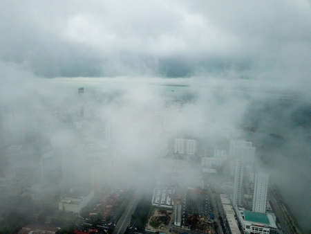 George Town, Penang/Malaysia - May 22 2019: Aerial view Jelutong covered with low cloud. Background is KOMTAR covered by cloud.のeditorial素材