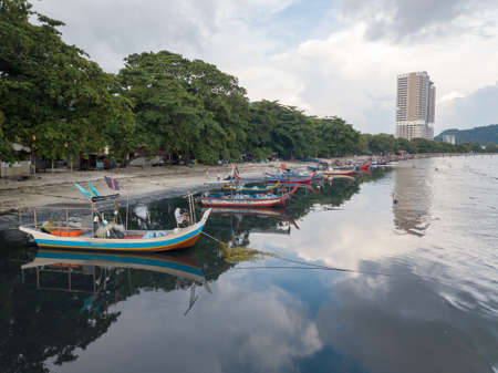 George Town, Penang/Malaysia - May 31 2019: Reflection of boat at Teluk Kumbar.のeditorial素材