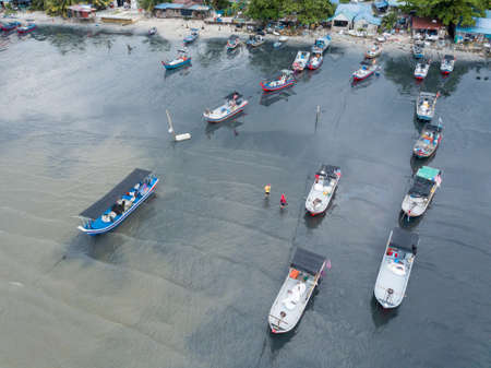 George Town, Penang/Malaysia - May 31 2019: Fisherman park the boats in row and go home.のeditorial素材