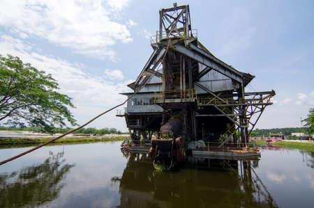Tanjung Tualang, Perak/Malaysia - Oct 07 2019: Tin Dredge No. 5 reflection in water.のeditorial素材