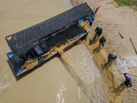 Penaga, Penang/Malaysia - Oct 27 2019: Aerial view fisherman cleaning the net near beach.のeditorial素材