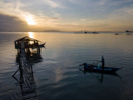 George Town, Penang/Malaysia - Nov 22 2019: Fisherman cast net in morning.のeditorial素材