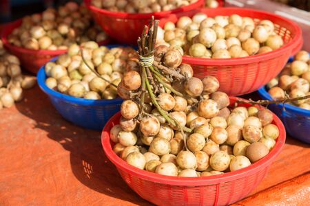 Lansium parasiticum fruit in basket.の写真素材